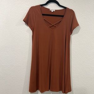 Rust criss cross woman’s dress